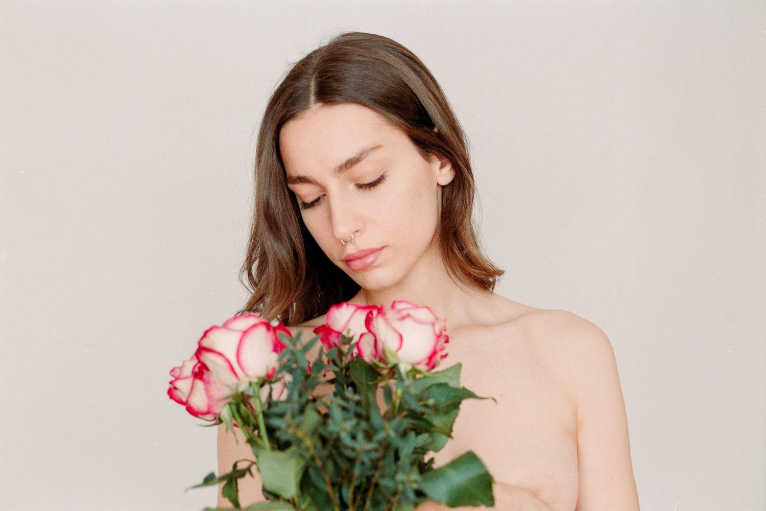 photo of a woman holding flowers