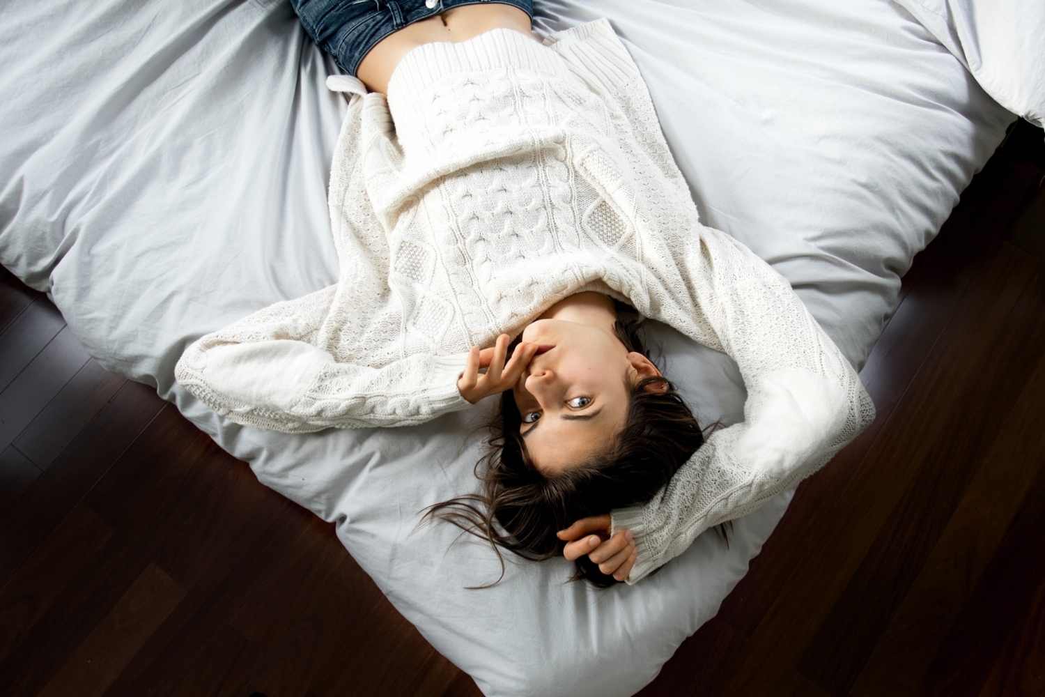 photo of a girl lying on the bed