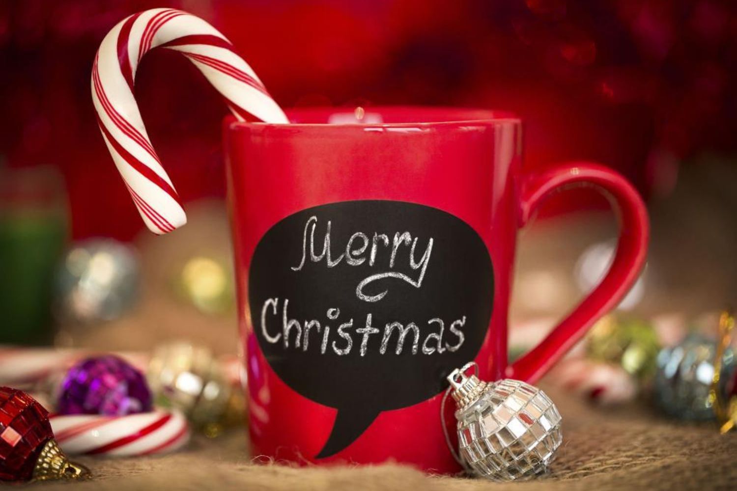 red mug with 'Merry Christmas' sign 