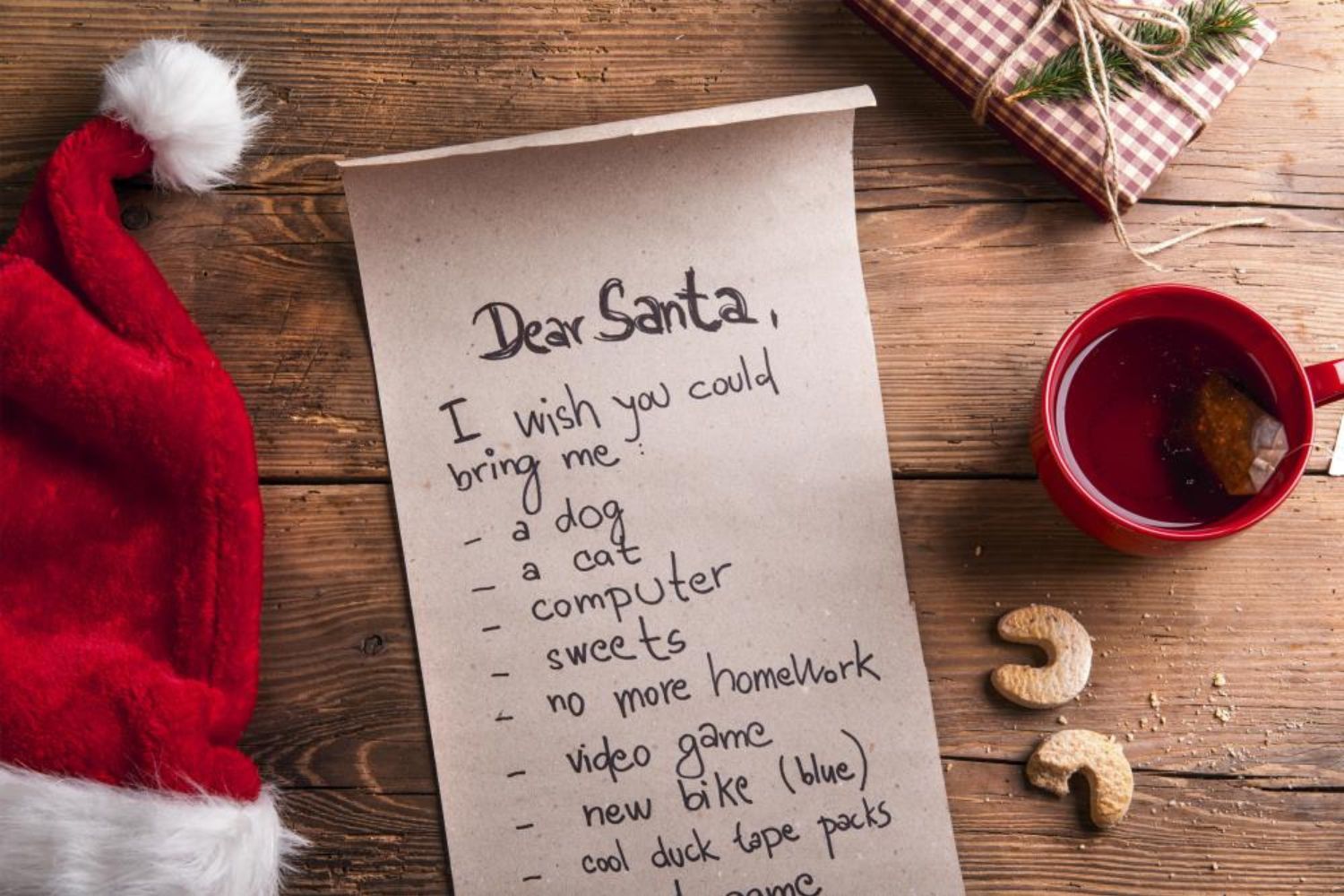 photo of letter to Santa on desk with Santa hat and cup of tea