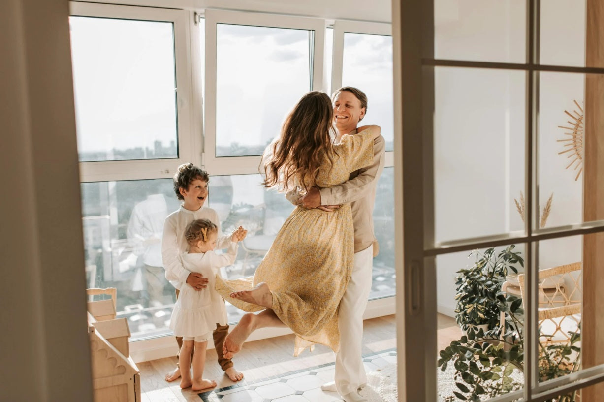 The two children watched with joy as their parents danced.