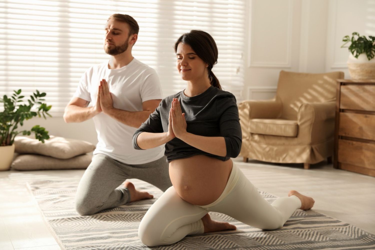 couple maternity photo by doing yoga together