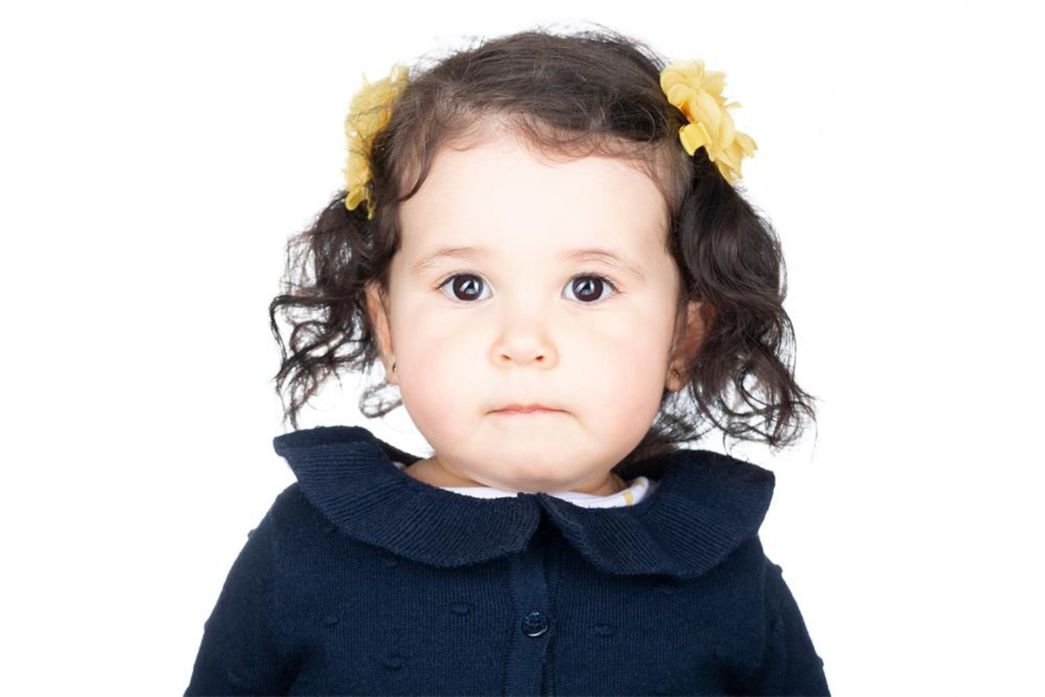 baby girl's headshot with white background