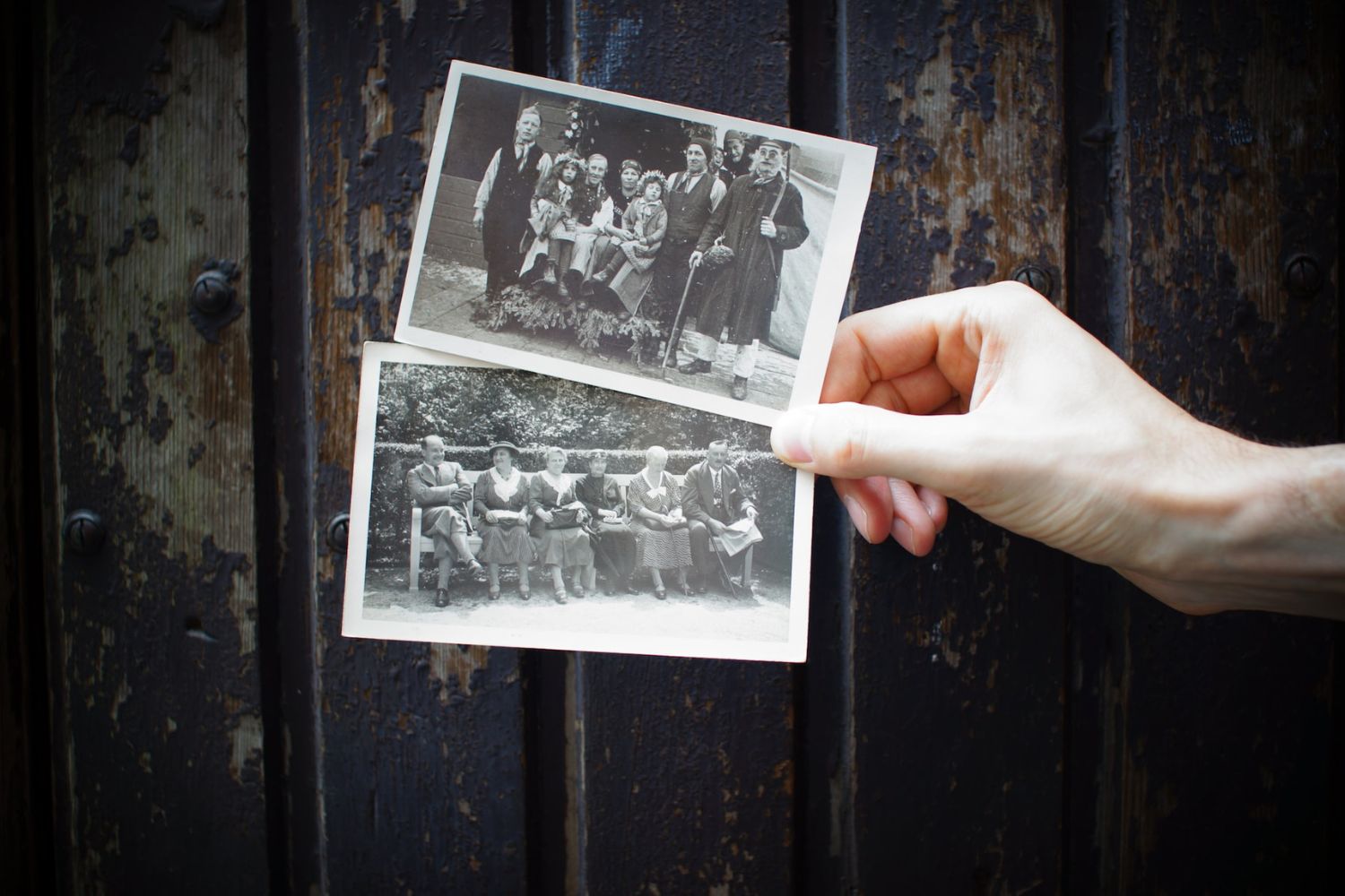 vintage printed white and black photos in hand