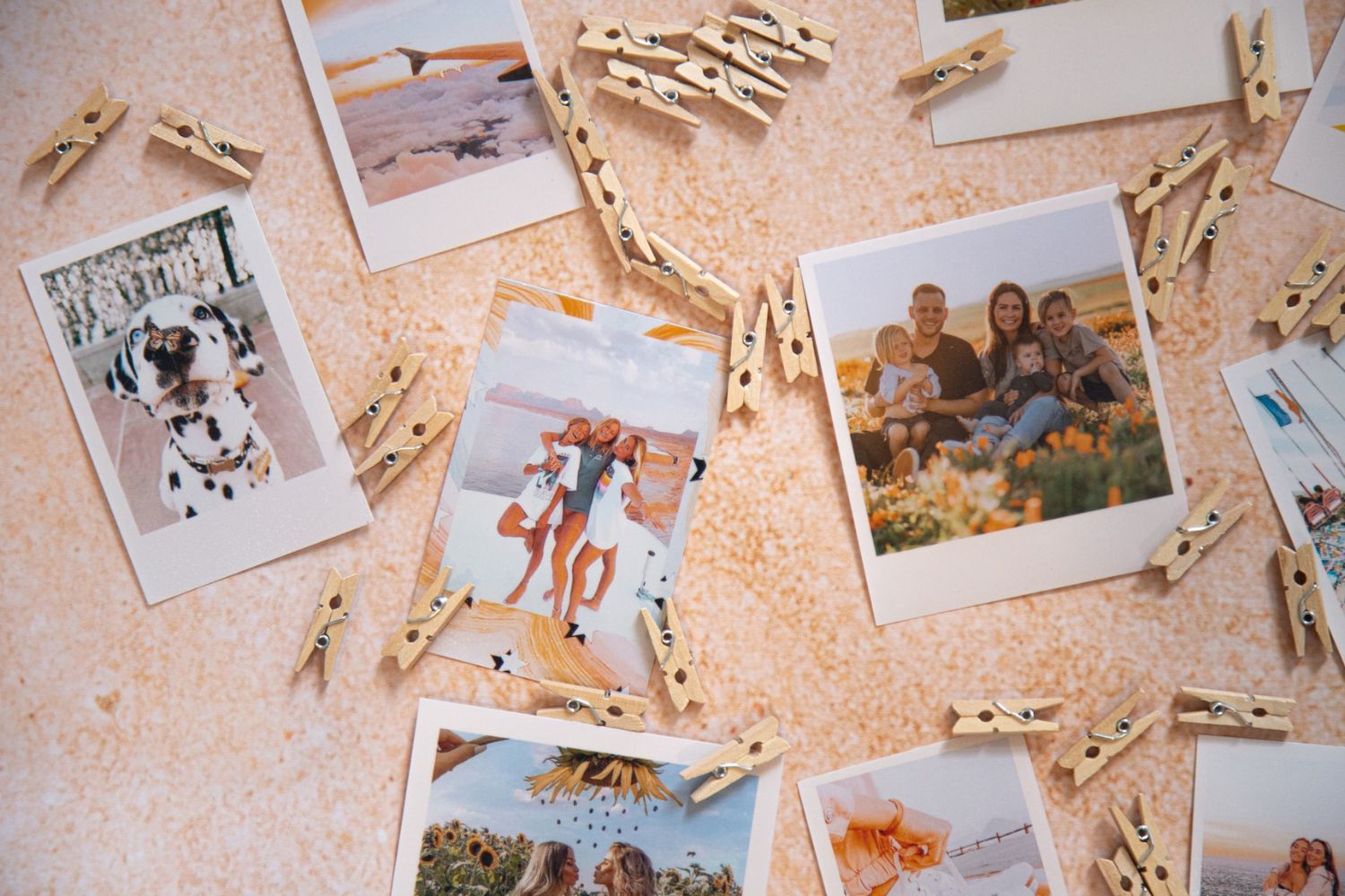 printed photos and wooden clips