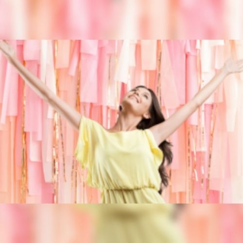 a girl in front of Streamers Photo Backdrop