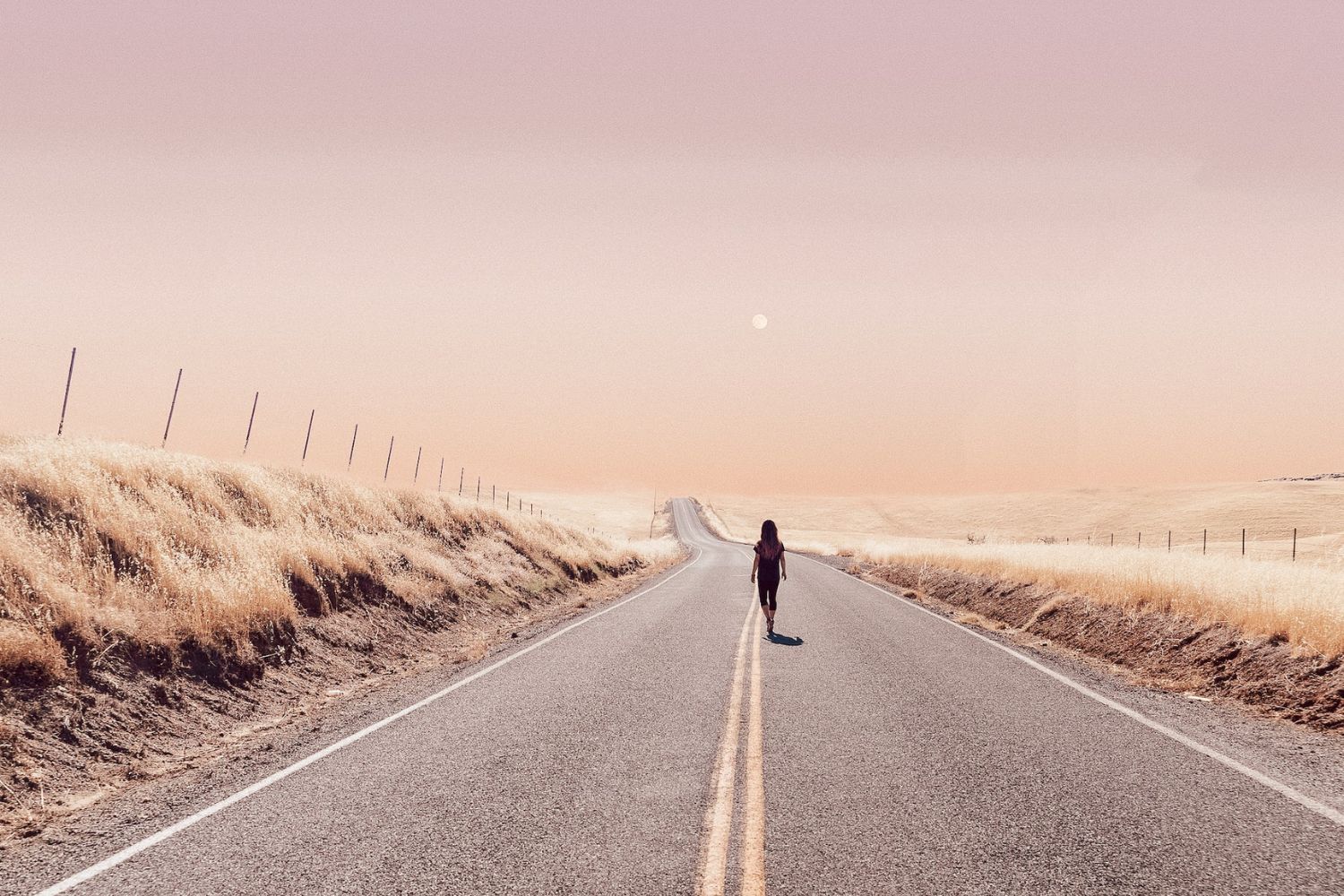 man walking on the extending road