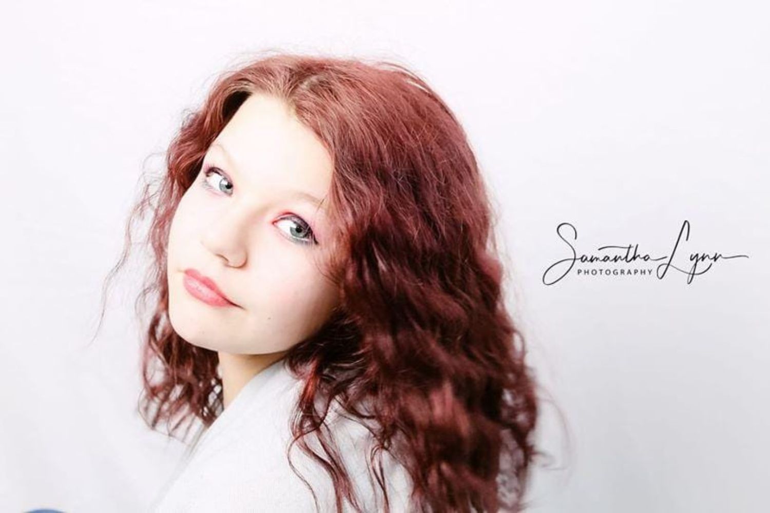 a young girl's headshot by looking through shoulder