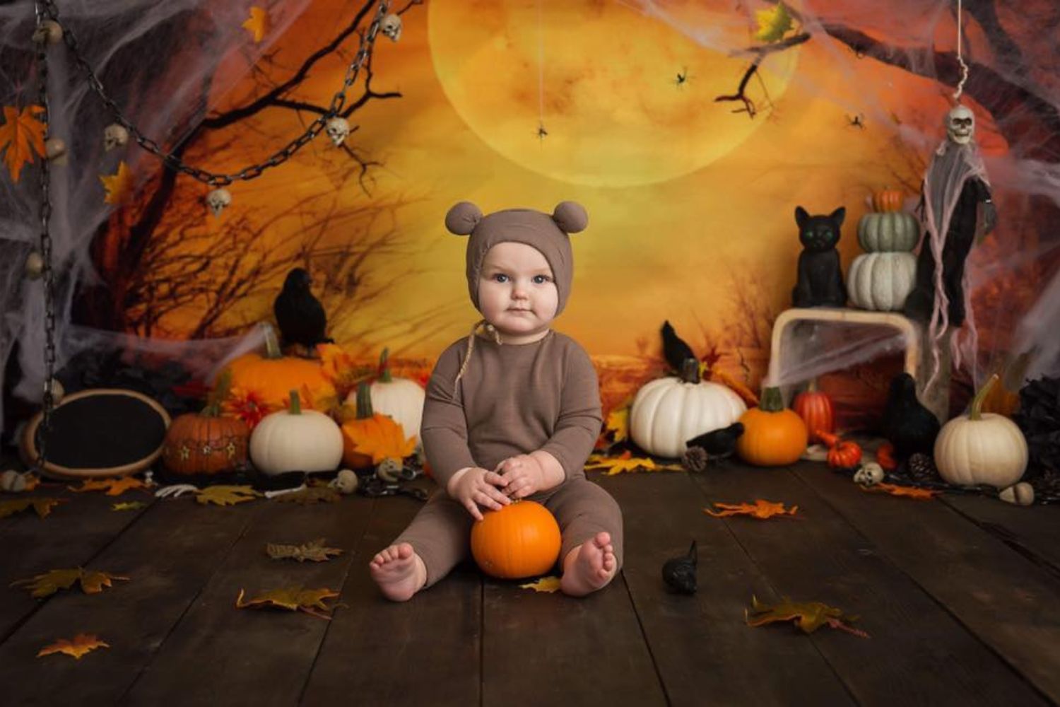 baby Halloween photo with pumpkins