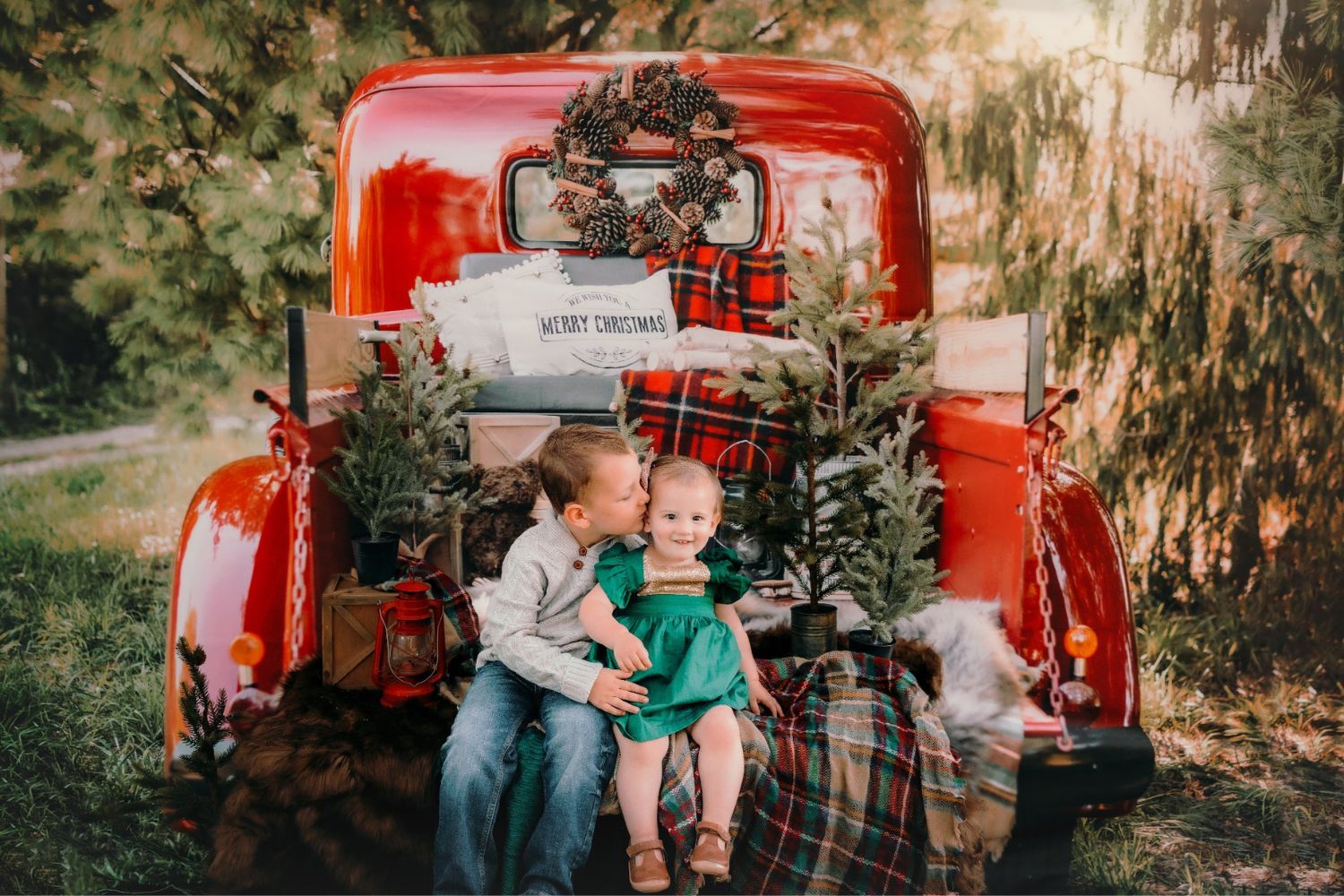 brother and sister Christmas photo with Kate Red Christmas Truck Backdrop Designed by Mandy Ringe Photography