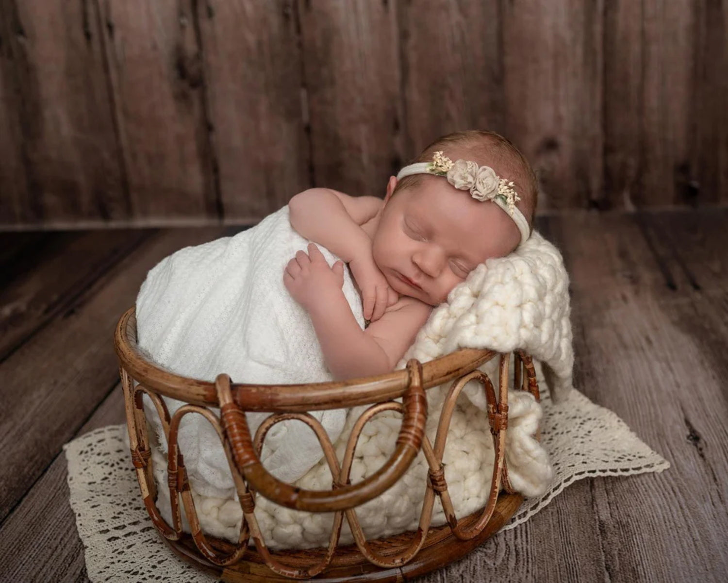 A baby lies down in a bamboo blanket