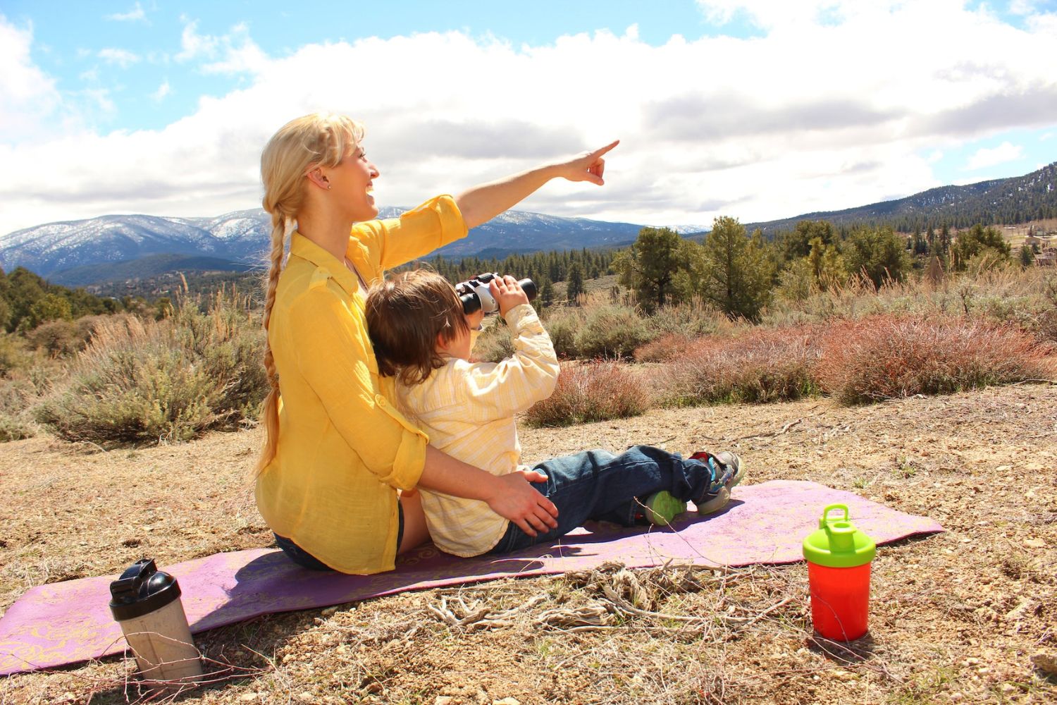 mom and son go camping on the hill