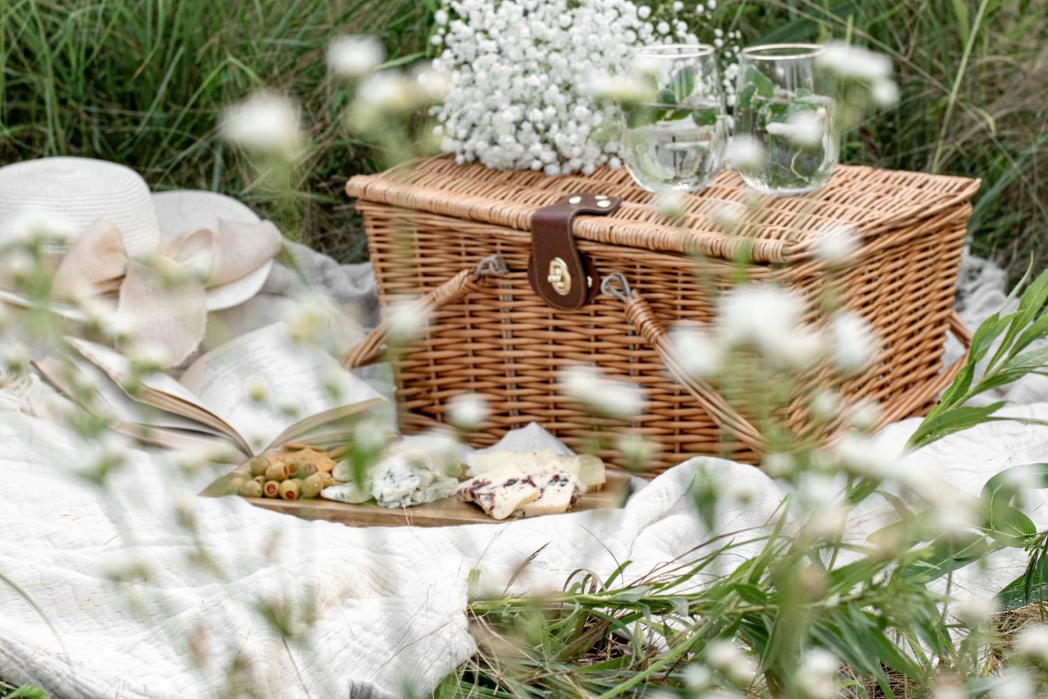 photo of picnic basket on the blanket
