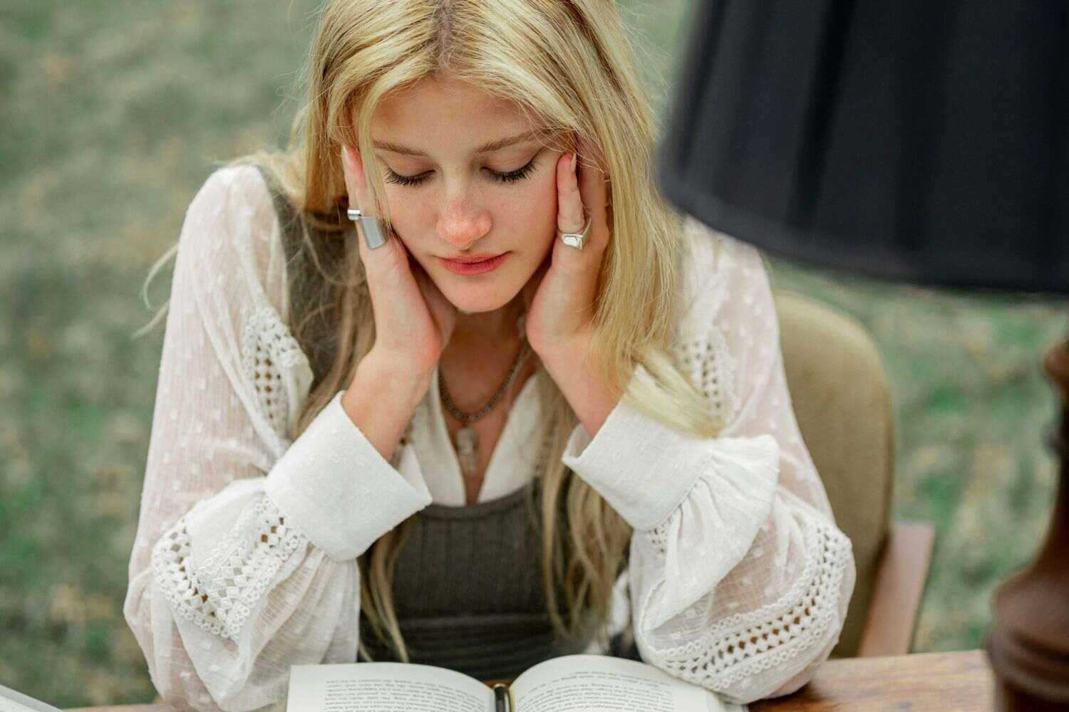 a photo of a cute girl reading a book