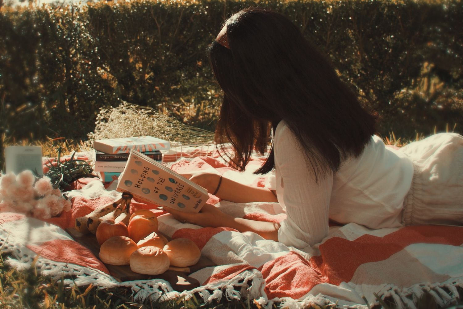 a girl reading photo when going picnic