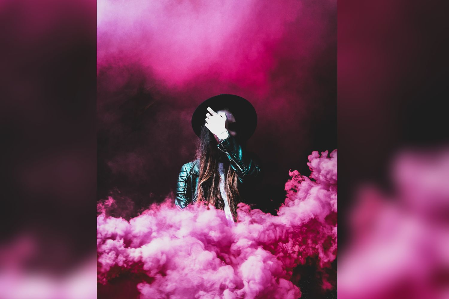 super cool girl behind magenta smoke bomb