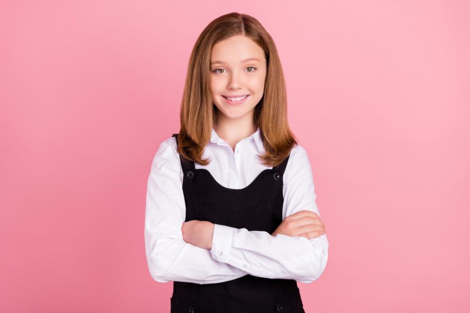 a well-dressed schoo girl posing for photo