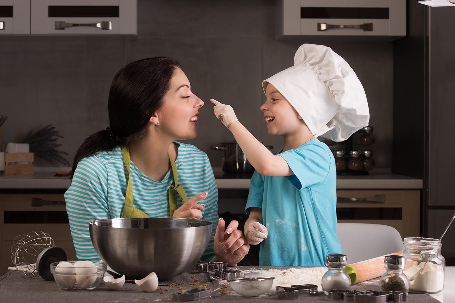 mom and son cooking together