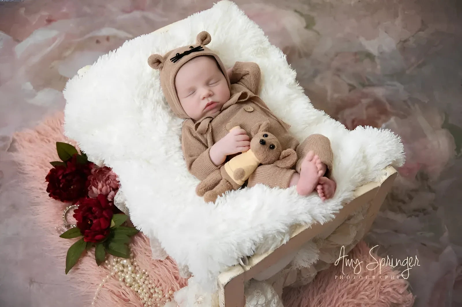 A serene newborn nestled in a cozy blanket, showcasing urban elegance.