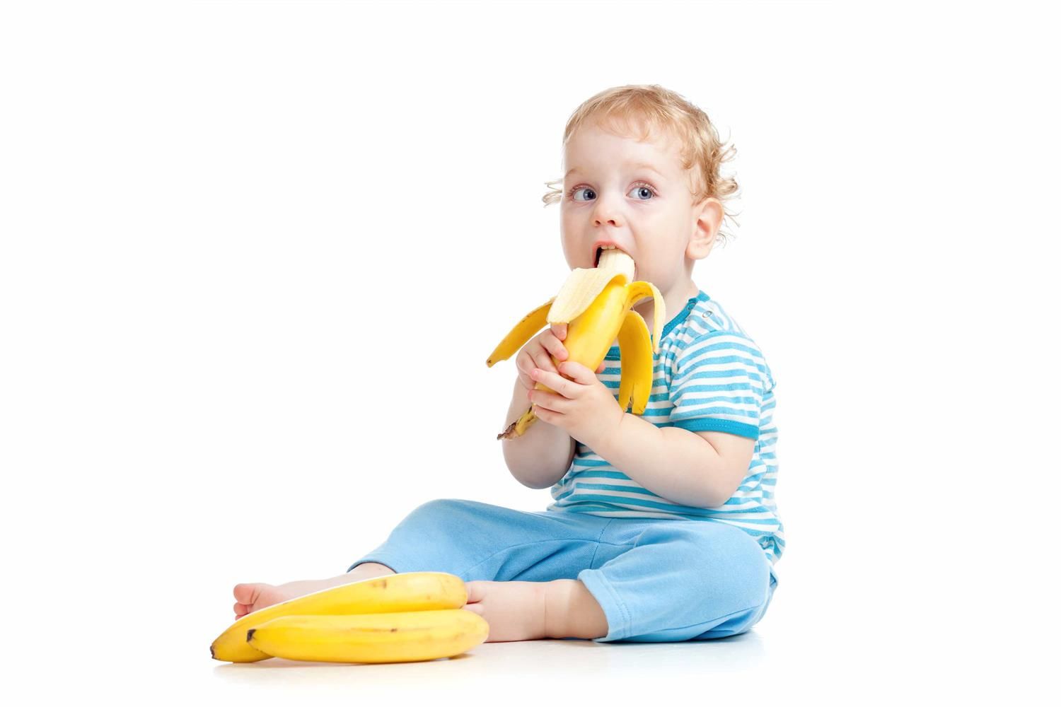 photo of baby eating banana