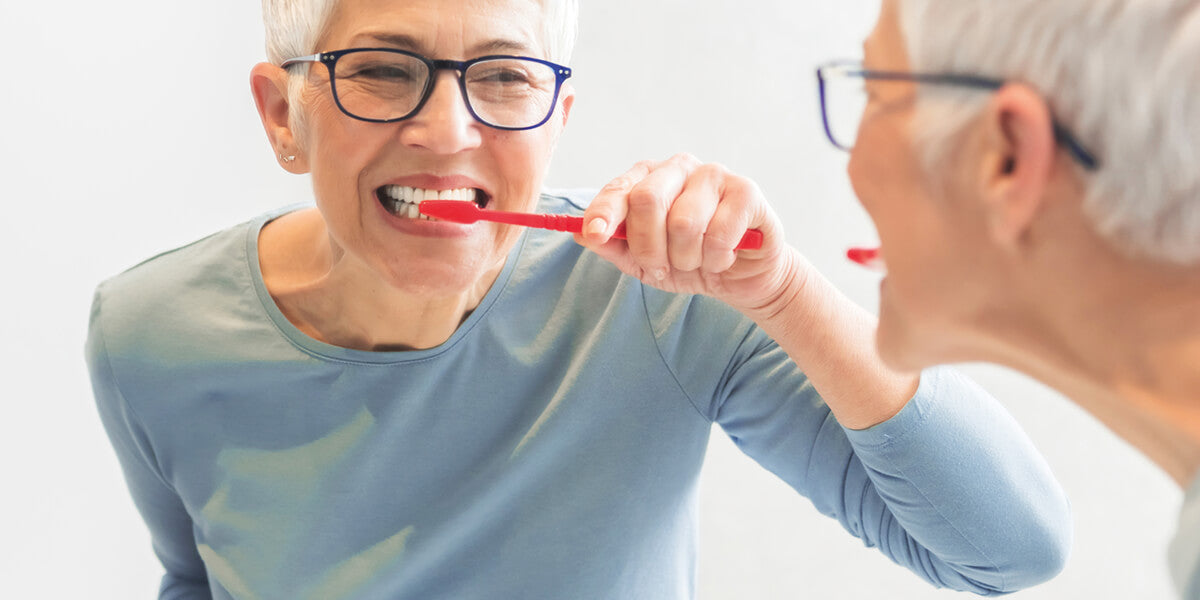 Lady brushing teeth image Dry Mouth