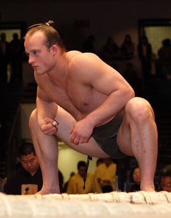 Takanoyama Shuntarō in sumo costume crouching