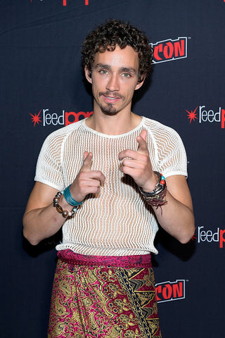 Robert sheehan in mesh top and kilt