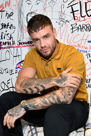 Liam Payne tattooed arms and mustard top 