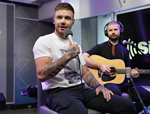 Liam Payne muscly arms and white tee with guitarist 