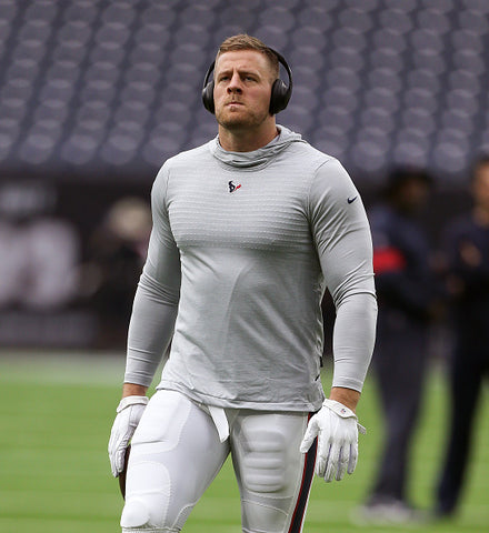 J.J. Watt pecs and biceps black headphones 