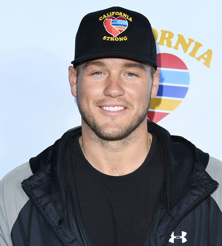 colton underwood with cap on and jacket