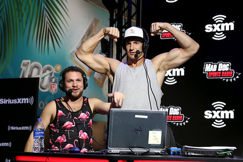 Rob Gronkowski flexes biceps on stage