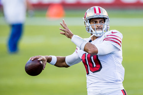 Jimmy Garoppolo about to throw ball helmet white