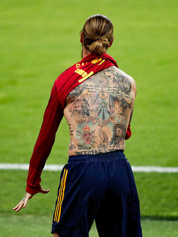 Sergio Ramos in navy shorts taking off red top body tattoos