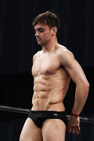 Tom Daley muscles out tiny trunks