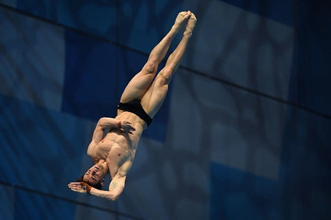 Tom Daley muscles out tiny trunks