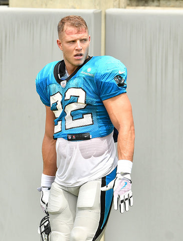 Christian McCaffrey blue top number 22 biceps 