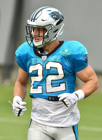 Christian McCaffrey blue top white gloves 