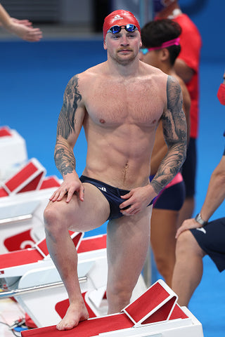 Adam peaty by pool topless tattoos