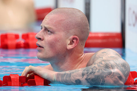 Adam peaty in pool shaved head