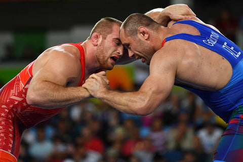 Kyle Frederick Snyder (Red) of the United States competes against Khetag Goziumov (blue) of Azerbaijan