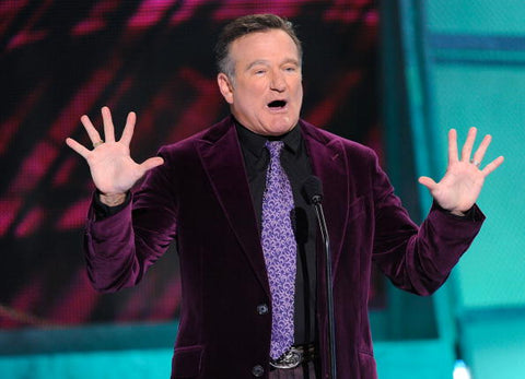 Robin Williams wearing a purple suit at People Choice Awards. 