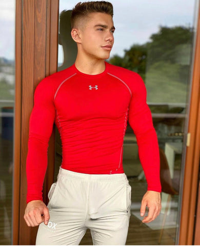 elio chalamet in red top and box joggers with bulge