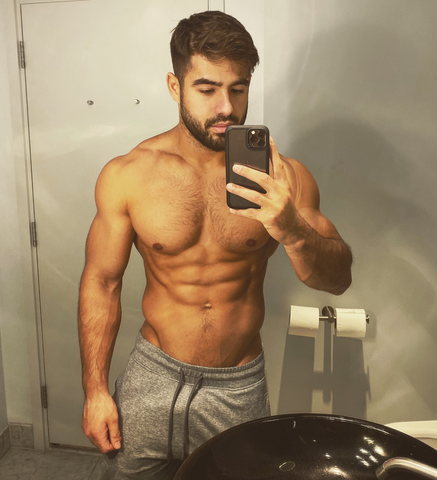 Dan Tai bathroom mirror selfie shirtless showing V in sweat pants