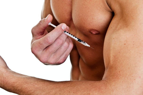 muscly man injecting arm