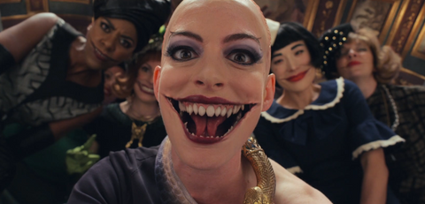 Anne Hathaway as grand high witch with fangs 