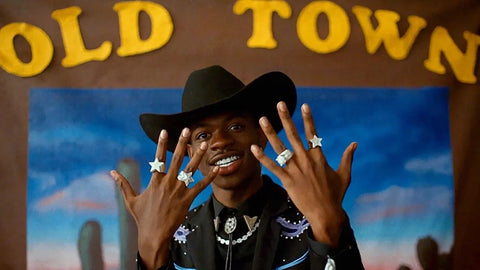 Lil nas x in old town road with hands up