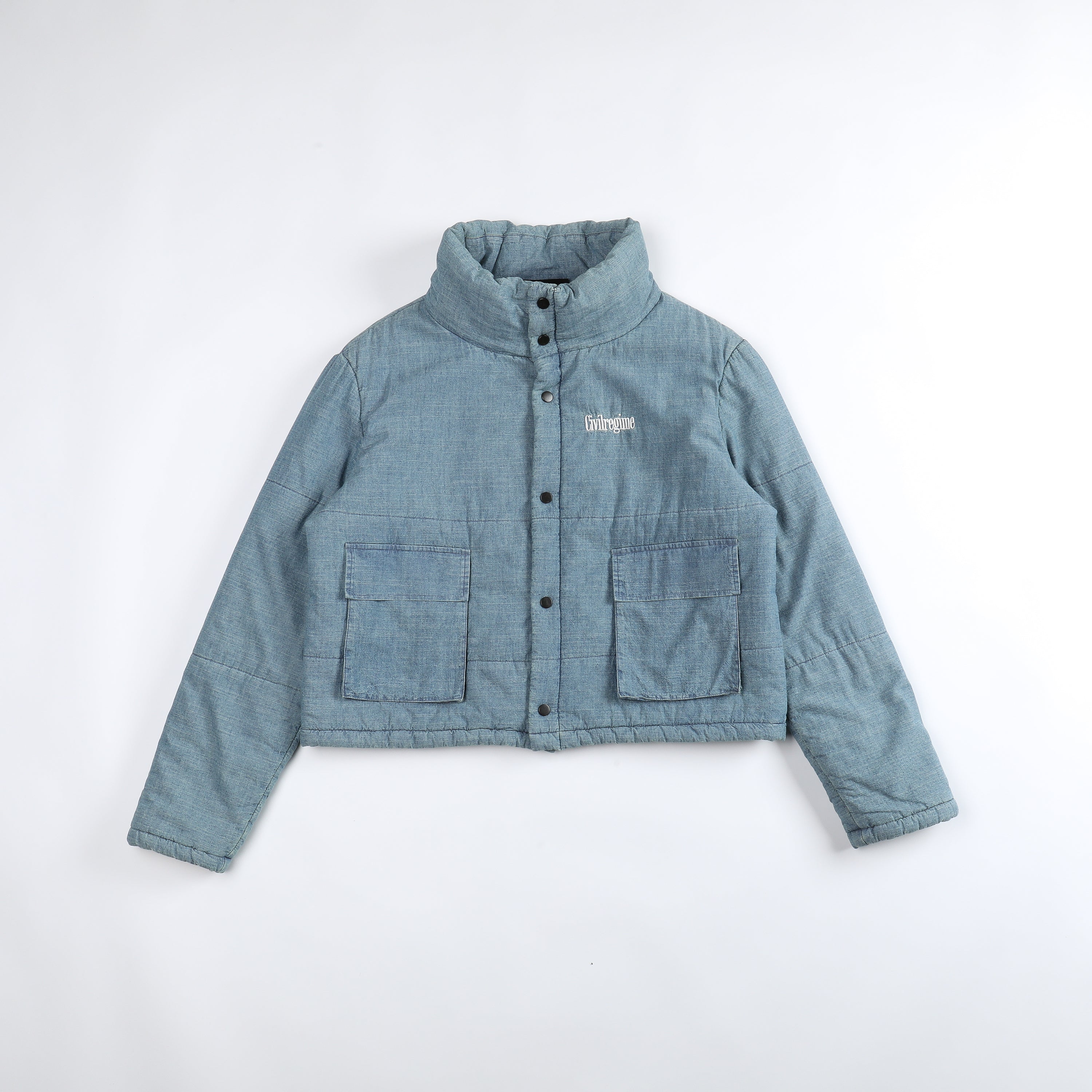 Image of Civil Regime Cropped Puffer Jacket in Light Blue Chambray