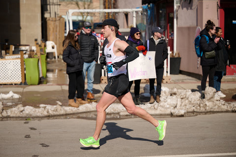 person running a half marathon in saucony shoes