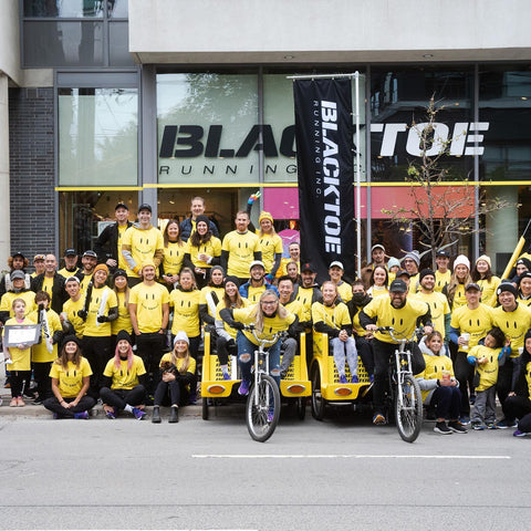 group of people cheering at a race in Toronto